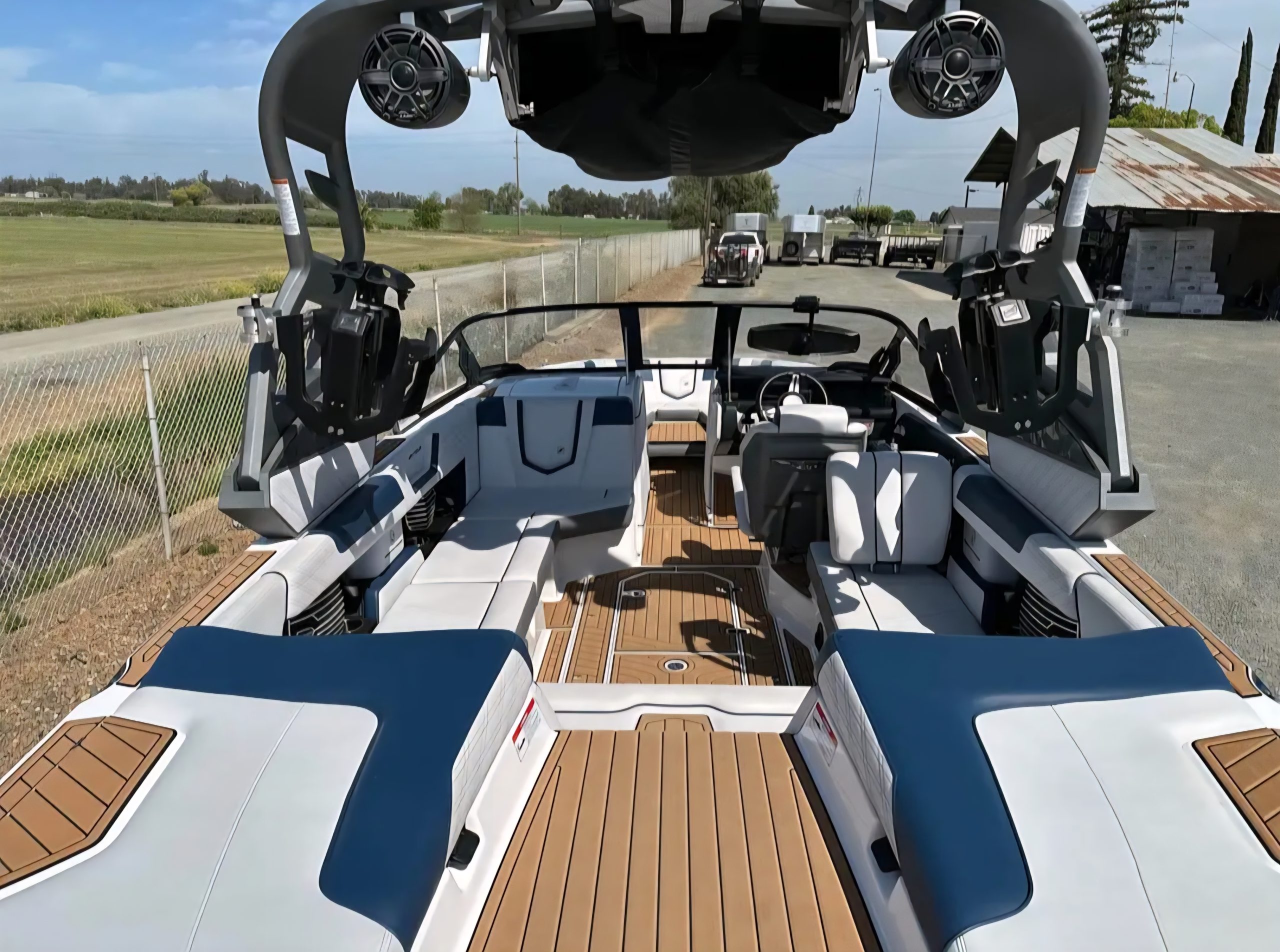 Interior view of Super Air Nautique G23 showing cockpit seating and teak-style flooring