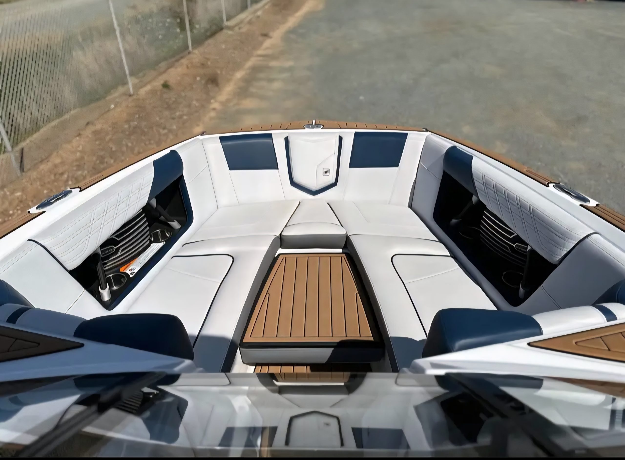 Bow seating area inside Super Air Nautique G23 with wraparound luxury lounge seats