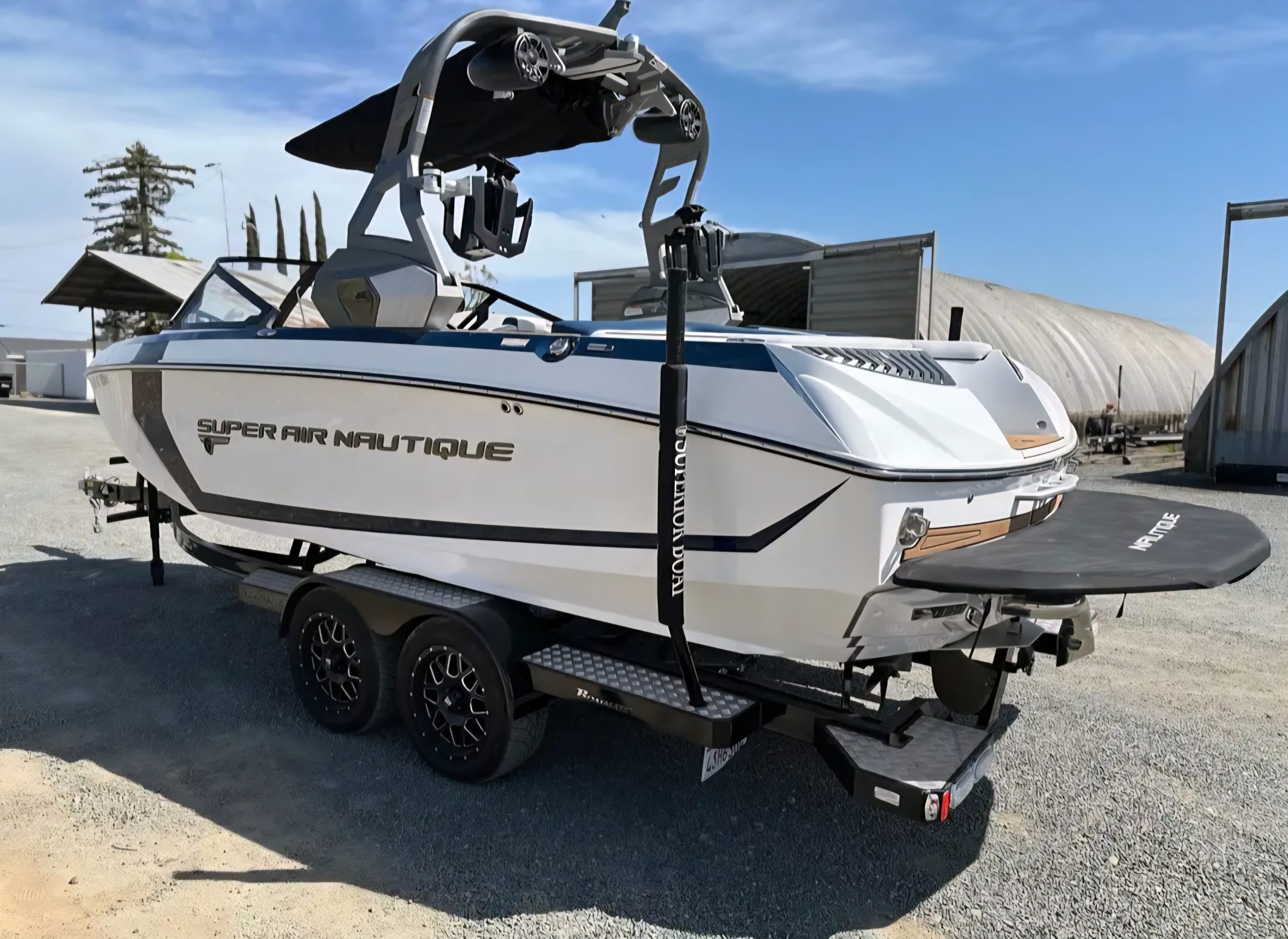 Rear exterior view of Super Air Nautique G23 showcasing swim platform and tower setup